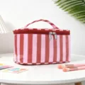 Bolsa de aseo impermeable con rayas rosa y cierre de cremallera para viajes diarios. - Rayas Rojo y Rosa