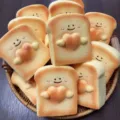 Cute slow rebound bread squishy toy with smiling face and heart design, soft stress relief item. - Heart Toast