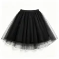 Detailed close-up view of a classic black tulle mesh midi skirt featuring elegant sheer design. - Black