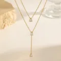 Exquisite double-layer teardrop zircon necklace, delicate gold clavicle chain detail. - Double Layer Water Drop White Rhinestone Necklace / Gold