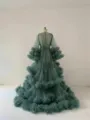 Detailed view of the sheer tulle maternity photography dress with layered ruffles and long sleeves. - S / Dresses / Dark Green