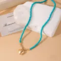 Collar de cuentas turquesas con colgante de corazón dorado, joyería de estilo bohemio para mujer. - Estilo de Cuentas de Corazón / Azul