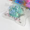 Cute cat paw resin decompression toy detail shot with pearls and glitter bead decoration. - Green Gold Cat Paw