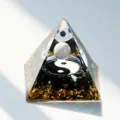 Handmade epoxy resin pyramid ornament featuring crystal gravel and yin yang symbol for home decor. - AG 1