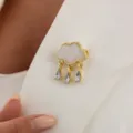 Close-up detail shot of a creative cloud shaped brooch with glittering crystal waterdrop tassels. - Creative Cloud Tassel Style (0465) / Gold