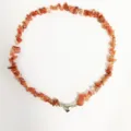 Detail shot of natural crushed stone beaded necklace with a heart magnetic clasp, irregular. - Red Agate