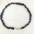 Close-up detail of natural lapis lazuli stone chip beaded necklace with magnetic heart clasp. - Lapis Lazuli