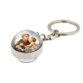 Exquisite metal keychain featuring a dome glass pendant with St. Anthony religious art design. - St. Padua