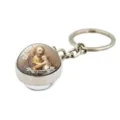 Close-up of religious theme glass dome keyring with metal base and St. Joseph detail pendant. - Saint Joseph
