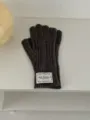 Dark grey cable knit gloves detail view, winter warm woolen gloves with brand label. - One Size / Dark Gray
