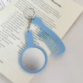Ensemble porte-clés miroir et peigne bleu portable, élégant accessoire de sac chic. - Bleu ciel