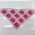 Detailed view of the cute pink crochet strawberry bandana, featuring vibrant knit flower motifs. - One Size / Pink Strawberry