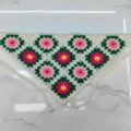 Detailed view of handmade crochet floral triangle headscarf, colorful knitted bandana hair accessory. - One Size / Green Granny Square