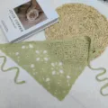Light green crochet triangle scarf detail, featuring hollow floral pattern and side ties. - One Size / Green Square