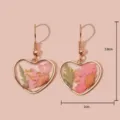 Heart-shaped pressed flower earrings with clear resin and gold tone metal frame design. - Small Size Pink Flower