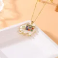 Exquisite copper elephant pendant necklace with colorful cubic zirconia and white enamel details. - White