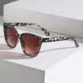 Modische Cat-Eye-Sonnenbrille mit stilvollem Leopardenmuster und braunen Farbverlaufslinsen. - Weißer Leopard Rahmen Braune Linse