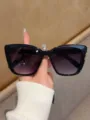 Schwarze Katzenaugen Sonnenbrille für Damen und Herren Mode UV-Schutz stilvolles Accessoire - Schwarzer Rahmen Graue Linse