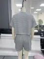 Back detail view of black and white striped knit pajama shorts set for comfortable lounging. - Back View