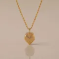 Vintage gold heart photo locket necklace with cross engraving and elegant rope chain style. - Cross Heart Locket