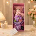 Valentine gift box with a cute pink teddy bear doll and purple soap rose flower bouquet. - Dusty Pink Teddy Bear Bouquet