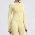 Seamless long sleeve sports top and leggings set in light yellow, ideal for yoga and gym. - Light Creamy Yellow