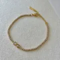Goldfarbenes Tennisarmband mit funkelnden Zirkonia Kristallen und Herz Anhänger Mode - Transparenter Schleifenstil