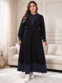 Detailed view of a plus-size color-block hooded maxi dress with long sleeves and zipper. - Navy Blue