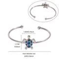 Stainless steel open cuff bracelet featuring a blue glitter sea turtle charm for women. - Steel Color Blue Glitter Turtle Style (B2307P-1)