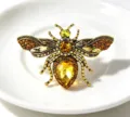 Vintage crystal bee brooch detailed with amber rhinestones, elegant insect pin apparel accessory. - Yellow