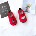 Red toddler elastic canvas slip-on shoes in red with cute cat cartoon design for boys and girls daily. - Black Cat on Red Background