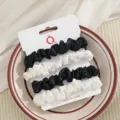 Satijn haarrekkers set voor dames en meisjes, elegante zwarte en witte paardenstaart houders. - Zwart en Gebroken Wit