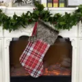 Red and grey plaid Christmas stocking with plush faux fur cuff, festive holiday decoration. - Light Colored Plaid Stocking
