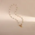 Elegante collana di perle d'acqua dolce con perline metalliche e ciondolo a cuore stile vintage. - Stile 6