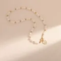 Collana di perle d'acqua dolce vintage francese con perline d'oro e ciondolo a moneta. - Stile 7