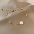 Exquisite rhinestone cross pendant gold bracelet fashion jewelry elegant wrist accessory - Starburst Bracelet