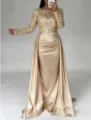 Elegant gold sequin long sleeve evening dress with satin drape skirt for formal events. - Light gold