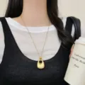 Minimalist gold long sweater chain necklace with unique geometric pendant for women stylish. - Bag Chain Necklace / Gold