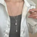 Minimalist silver long pull necklace with teardrop pendants, elegant sweater chain accessory. - Double Water Drop Necklace / Matte Silver