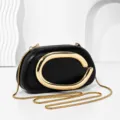 Elegant black evening clutch bag with gold chain strap and metal C clasp design for women - Black