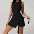 Black sleeveless athletic dress for women, featuring a chic wrap skirt design with tie waist. - S / Dresses / Black