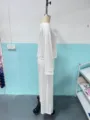 Casual white long sleeve top and wide leg pants set detail view showcasing fabric texture. - XS / Top And Bottom / White