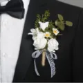 Elegant white artificial rose boutonniere with lace ribbon for wedding or business meeting. - Corsage / White