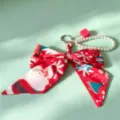 Christmas ribbon bow keychain with pearl chain and bag charm for women styling. - Silver Ring Buckle + Silk Scarf Bow + Pearl Chain / Christmas Red