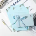 4 Bronzing Papers + 1 Envelope (Metallic Rose) + 1 Ribbon + 1 Pen
