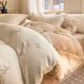 Embroidered milk velvet four-piece bedding set with "hui xuan" bow - creamy white/coffee
