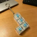 Carcasa transparente en forma de L de cuatro teclas