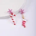 Bastoncino di zucchero e calza con stella rosa
