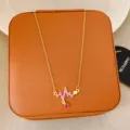 Gold with Red Rhinestone (T152 Red)