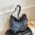 Large vintage denim shoulder bag in charcoal and blue patchwork, with frayed edges and charm - 42*11*34 / Gray